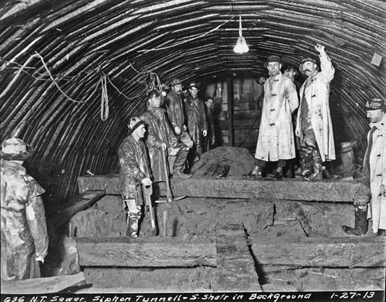 Seattle Municipal Archives Photograph Collection, Item No. 6229, workers in the North Trunk Sewer, Siphon Tunnel, 1913 Seattle Municipal Archives Photograph Collection, Item No. 6229, workers in the North Trunk Sewer, Siphon Tunnel, 1913