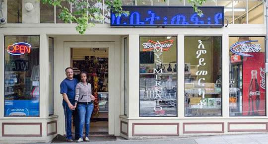 Mr. & Mrs. Filli & Yodit Abdulkdra in front of 'Amy's Merkato' store © 2013, photo by Madeline Crowley