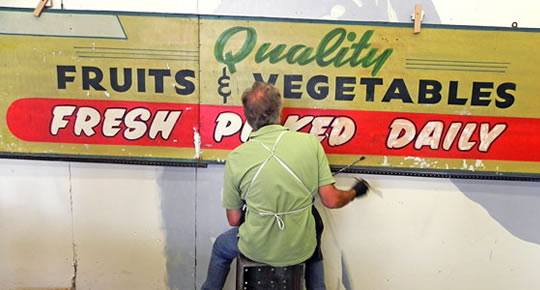 High Stall sign restoration at Zeppelin Studios © 2013, photo by LeAnn Loughran, courtesy of Friends of the Market.