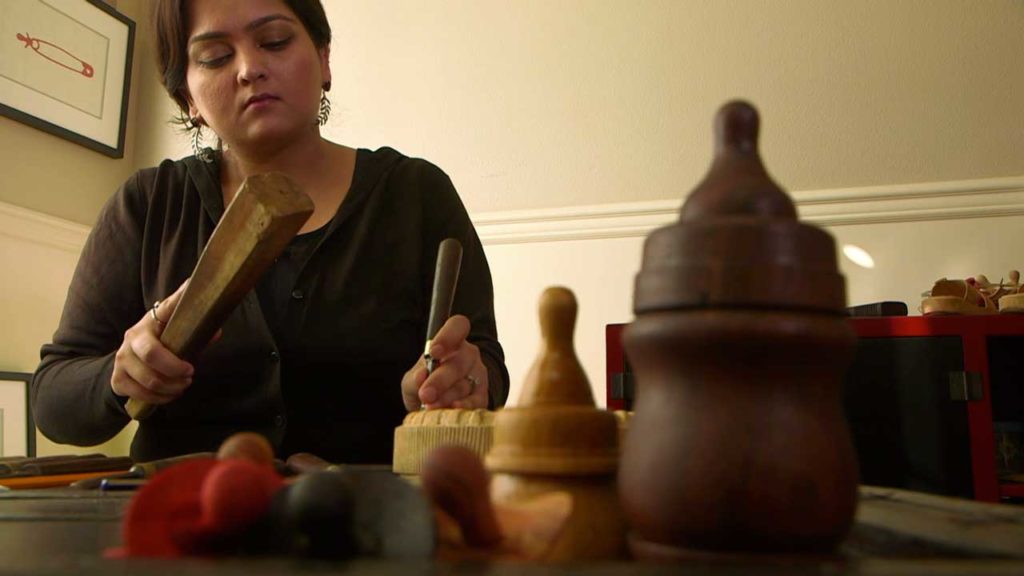 Humaira Abid carving in her studio, Video still © 2014 by Laila KazmiHumaira Abid carving in her studio, Video still © 2014 by Laila Kazmi