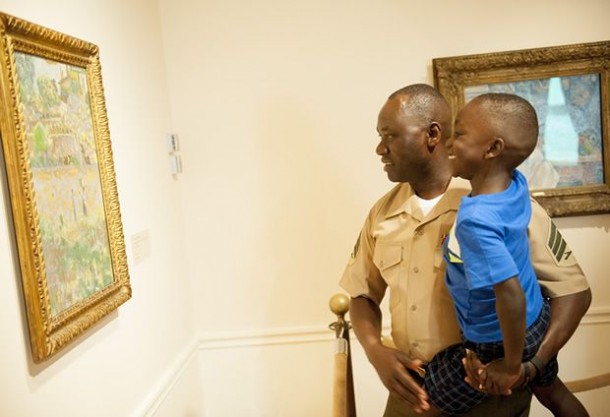 Marine Sgt. Jimmy Ochan and his son William enjoy their visit to the Phillips Collection at the 2015 launch event for Blue Star Museums.