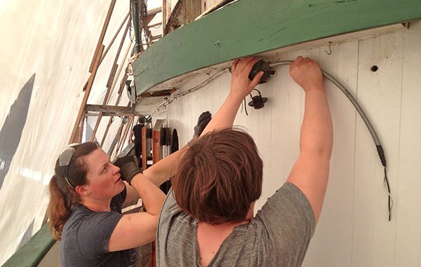 Working on electrical systems aboard Tudgboat Arthur Foss © 2015, courtesy of Northwest Seaport