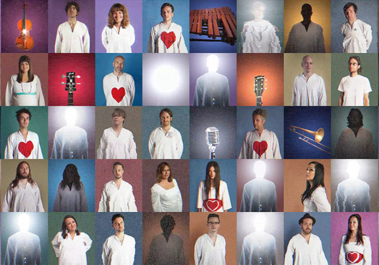Fifty square photographs are displayed in five rows of ten. Most of the photos depict people, but some depict instruments. All of the people are wearing white shirts, some of which have a red heart in the middle. The squares have a series of different backgrounds including a variety of shades of mauve, blue, purple, pink, green and yellow.