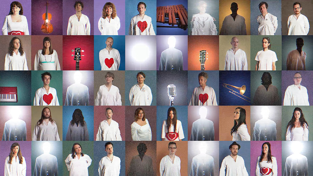 Fifty square photographs are displayed in five rows of ten. Most of the photos depict people, but some depict instruments. All of the people are wearing white shirts, some of which have a red heart in the middle. The squares have a series of different backgrounds including a variety of shades of mauve, blue, purple, pink, green and yellow.