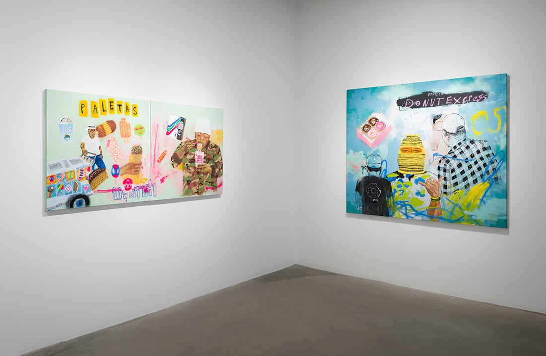 Two colorful, mixed-media paintings hang on white gallery walls. The left artwork features a paleta cart, snacks, and people; the right artwork depicts a figure in a mask and donuts, with bold, layered text and imagery.