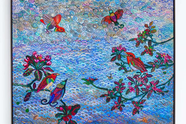 Colorful, intricate painting of birds perched on and flying around blossoming branches against a vibrant, swirling blue sky with decorative patterns and floral motifs. The artwork is framed in black.