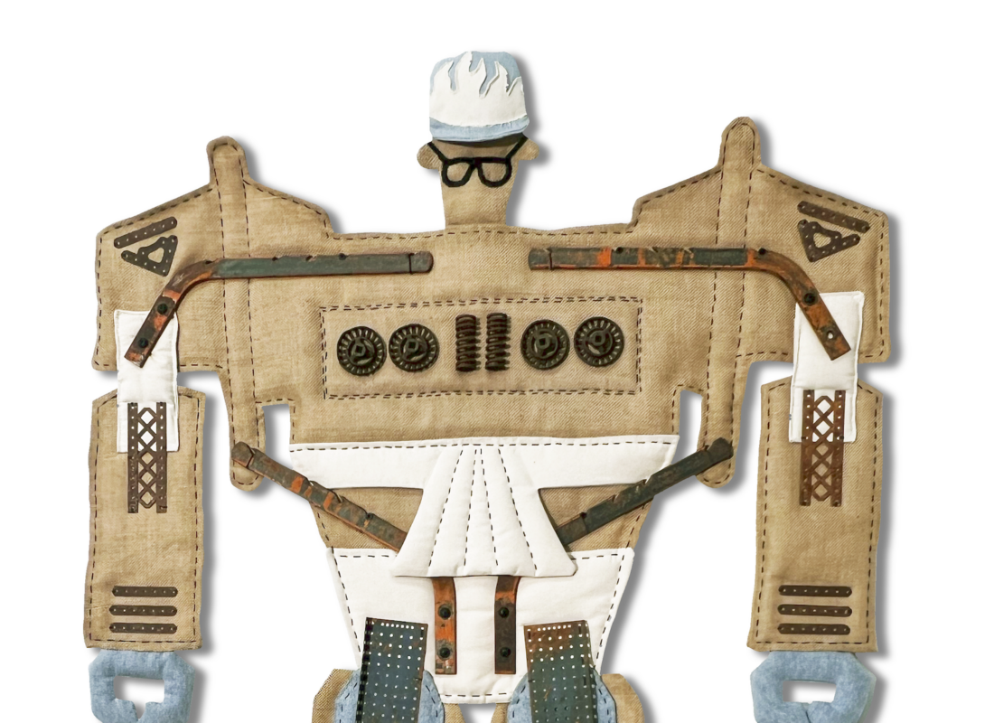 A robot figure made from cardboard, fabric, buttons, and other textured materials, with denim-like legs, a white triangular section on its torso, and a blue-white head wearing dark glasses and a cap.